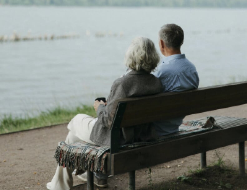 Elderly Couple Relaxing by Waterfront Independent Senior Living Elderly Couple Relaxing by Waterfront Independent Senior Living